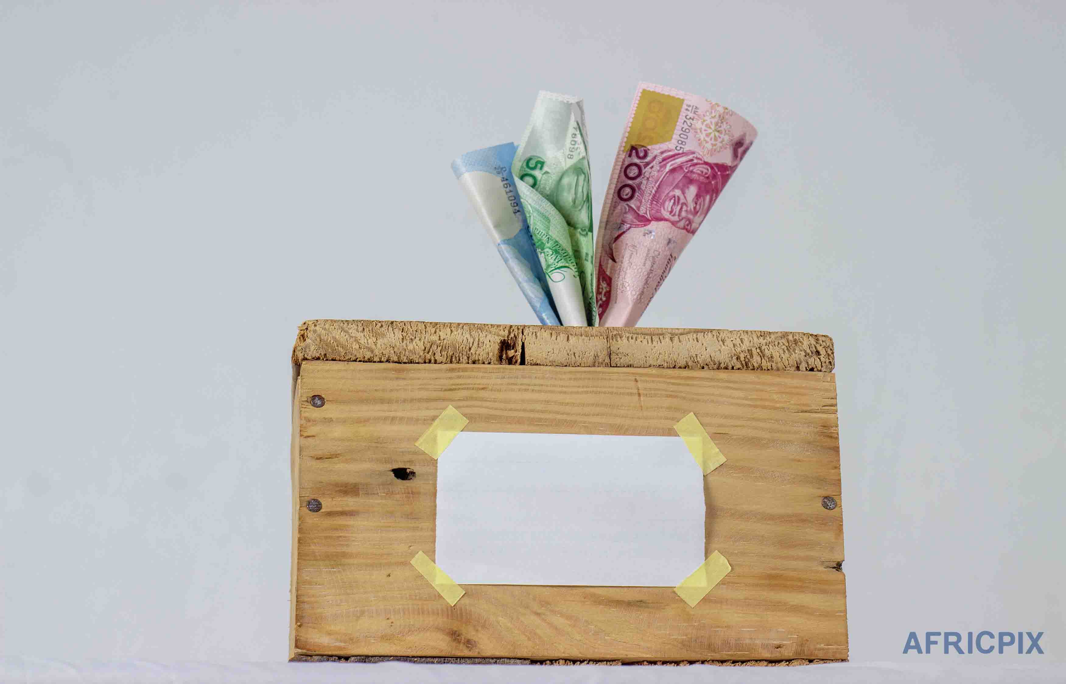 Saving Box (Kolo) and Naira Front View